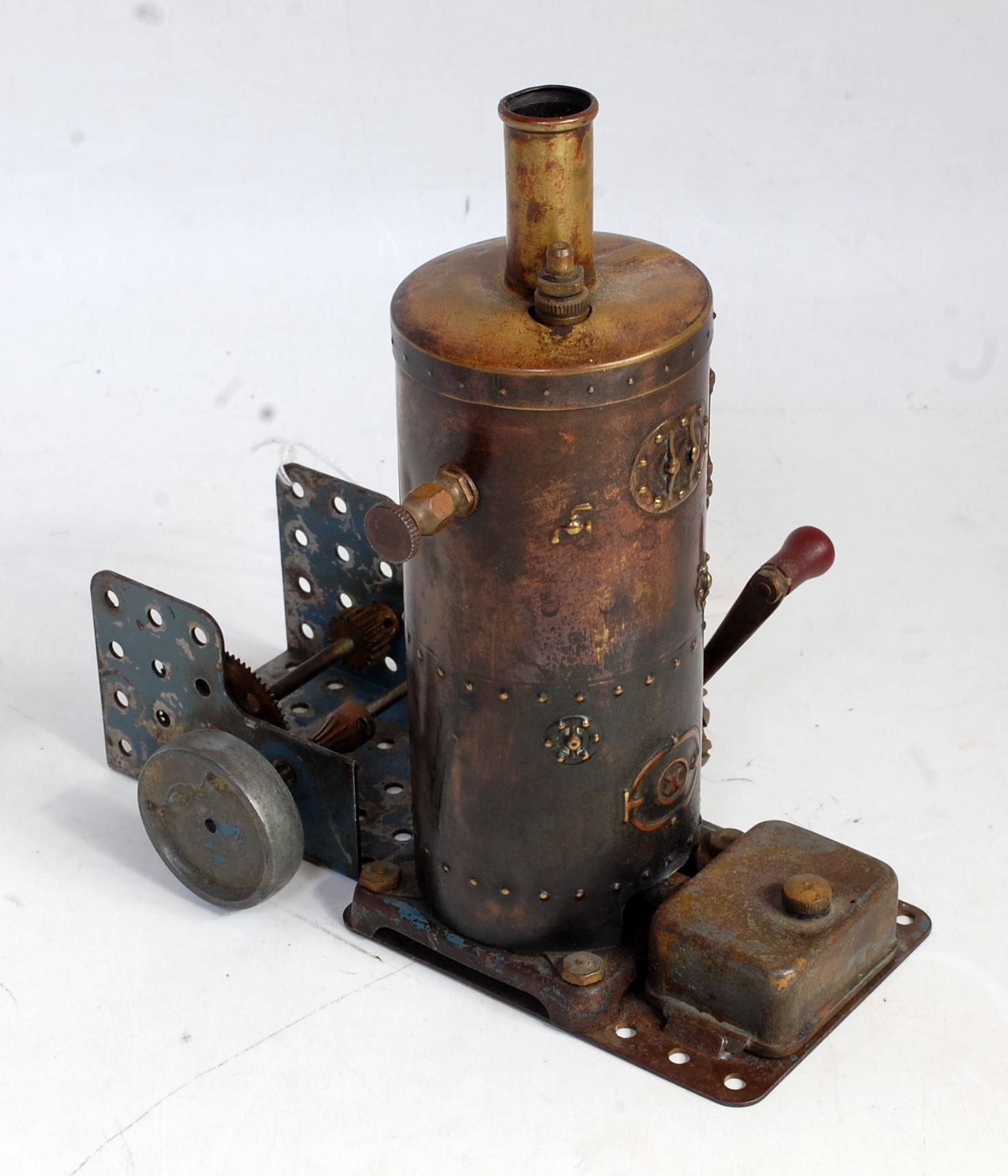 A very rare Meccano 1920s steam engine comprising of spirit fired vertical boiler with filler safety