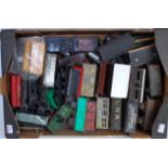Two large trays containing a wide variety of mainly incomplete loco, wagon and coach parts,