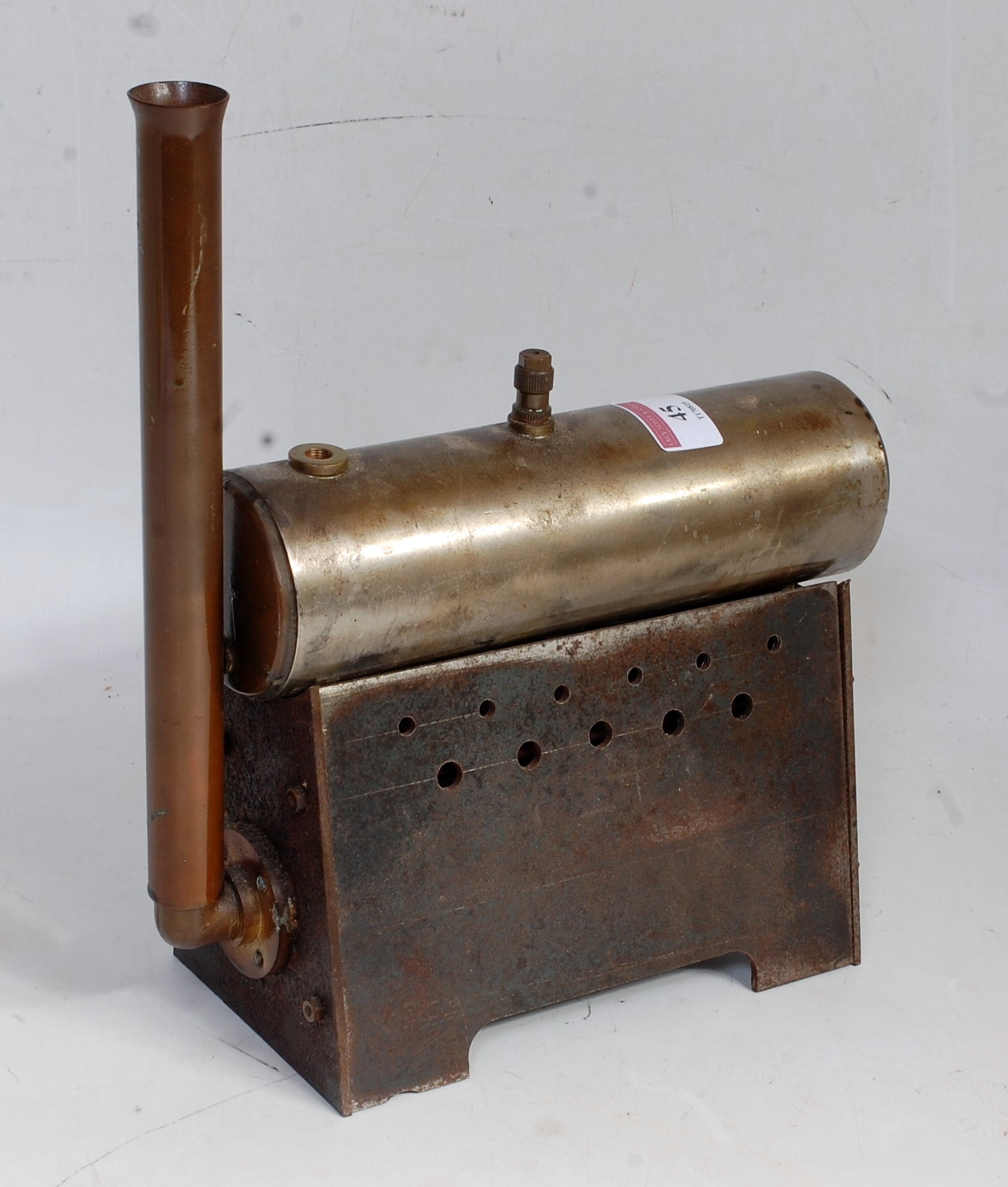 A small stationary steam boiler to power an engine consisting of three tube brass boiler, ventilator