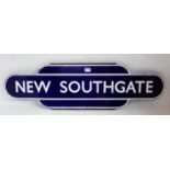 An original BR Eastern Region New Southgate totem sign, white on blue example, half flanged with six