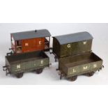 Four Bassett Lowke pre-war wagons; NE goods brake, GW goods van, LMS open and NE open, roofs re-