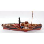 A kit built balsa wood and wooden model of a twin paddle steam boat comprising of red, black and