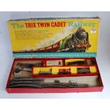 Trix Twin Cadet Railway box containing 0-4-0 plastic body tank engine, 3 wagons, track, etc (a/f)