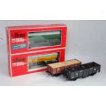 Four O gauge wagons: Rivarossi 4-wheel open; Lima 4-wheel open; Lima 6546 tank wagon and Lima