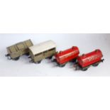 Four Bing wagons: 2x Motor Spirit Shell tankers, LMS cattle van and a lime/cement wagon (G)