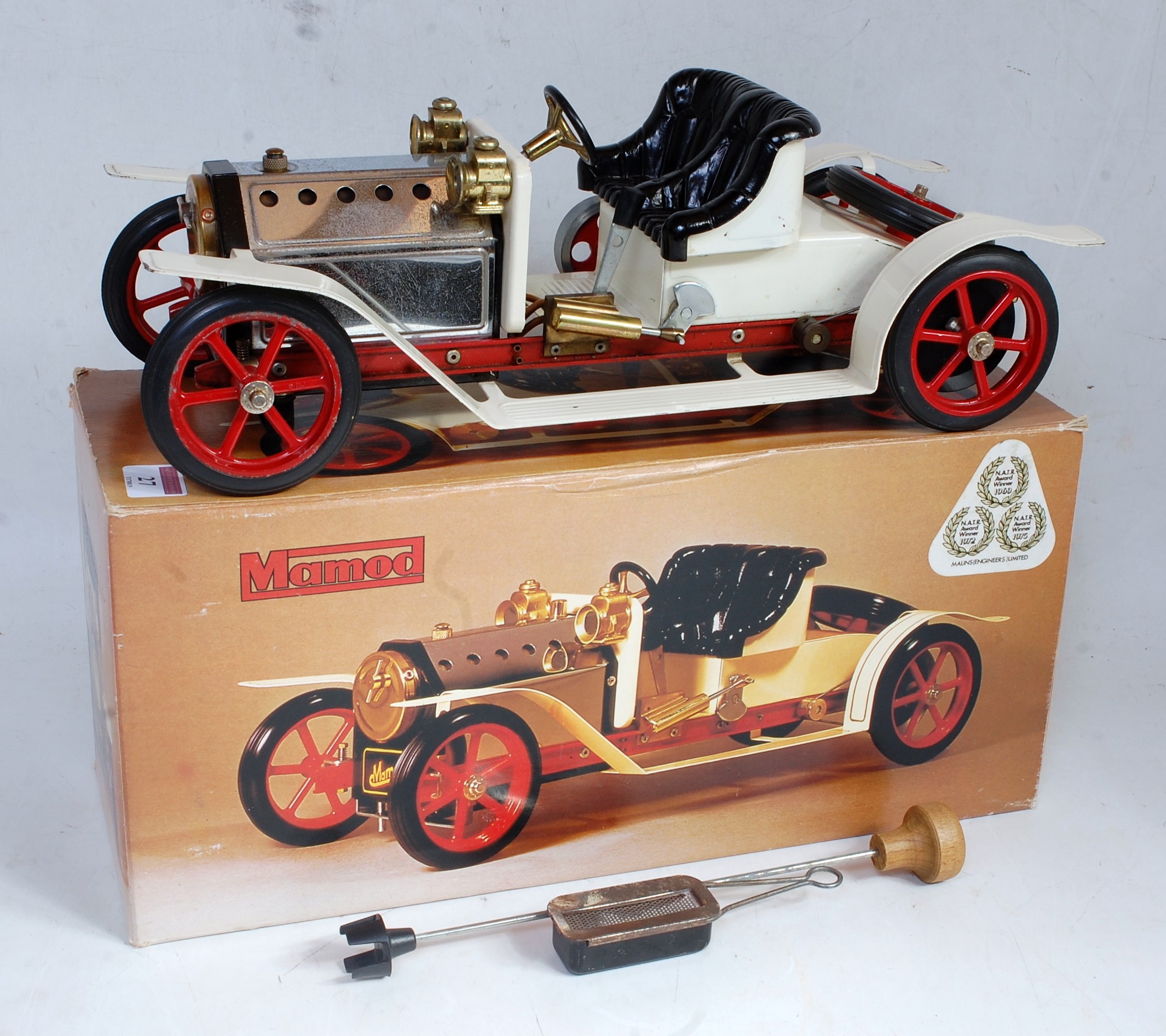 A Mamod steam roadster SA1 comprising white and red body, appears as issued in the original all-card