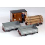 Four Mamod 16mm wagons: MR goods brake van, lumber wagon with load and two grey open wagons, a few