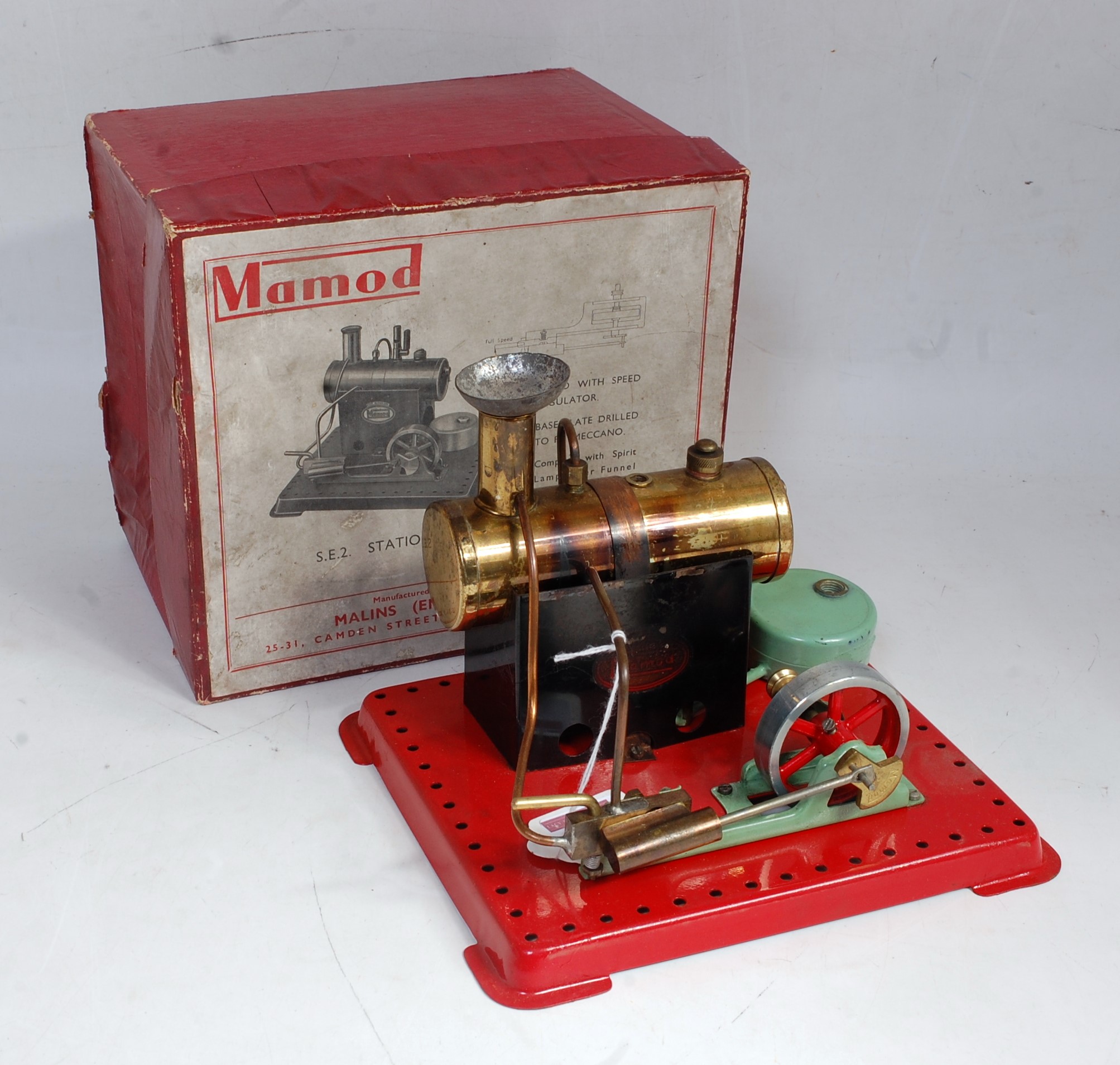 An early Mamod SE2 stationary steam engine comprising of copper housed boiler powering a single