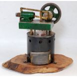 A scratch built stationary hot air steam plant comprising of tin housed and bean tin encased hot air