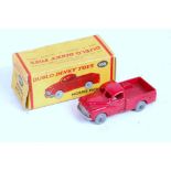 A 00 Dinky Toys No. 065 Morris Pickup comprising red body with grey hubs, in the original all-card