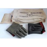 A British Railways canvas bag duly marked containing rubber gauntlets together with a railway towel