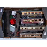 Two large trays containing a wide variety of bits and pieces Hornby wagons, coaches and accessories,