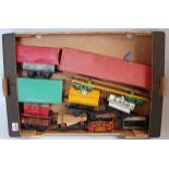 7 post war and one pre war Hornby wagons: 1933-5 No. 2 lumber, yellow base, green bolsters and