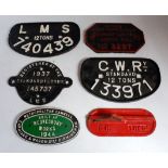 Six various cast iron railway wagon plates and signage to include LMS 12 tons 740439 wagon plate,