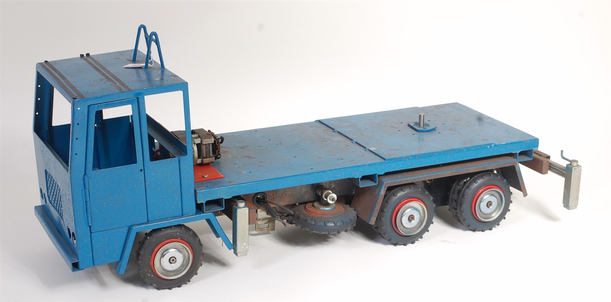 A heavily constructed three axle electric flat bed wagon for restoration fitted with large can motor