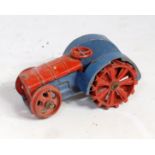 A Dinky Toys pre-war No. 22E farm tractor, comprising of blue and red body, model requires some