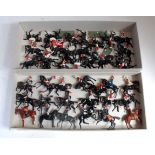 Two trays containing a large quantity of various Britains repainted and original mounted cavalry