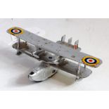 A Dinky Toys No. 60H four engined flying boat comprising of silver body with RAF roundels and two