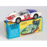 A Corgi Toys No. 330 Porsche Carrera 6 comprising of red and white body with cast hubs and driver