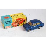 A Corgi Toys No. 251 Hillman Imp comprising of dark metallic blue body with yellow interior and