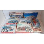 Eight various boxed plastic racing car and classic car kits, one example of military interest,