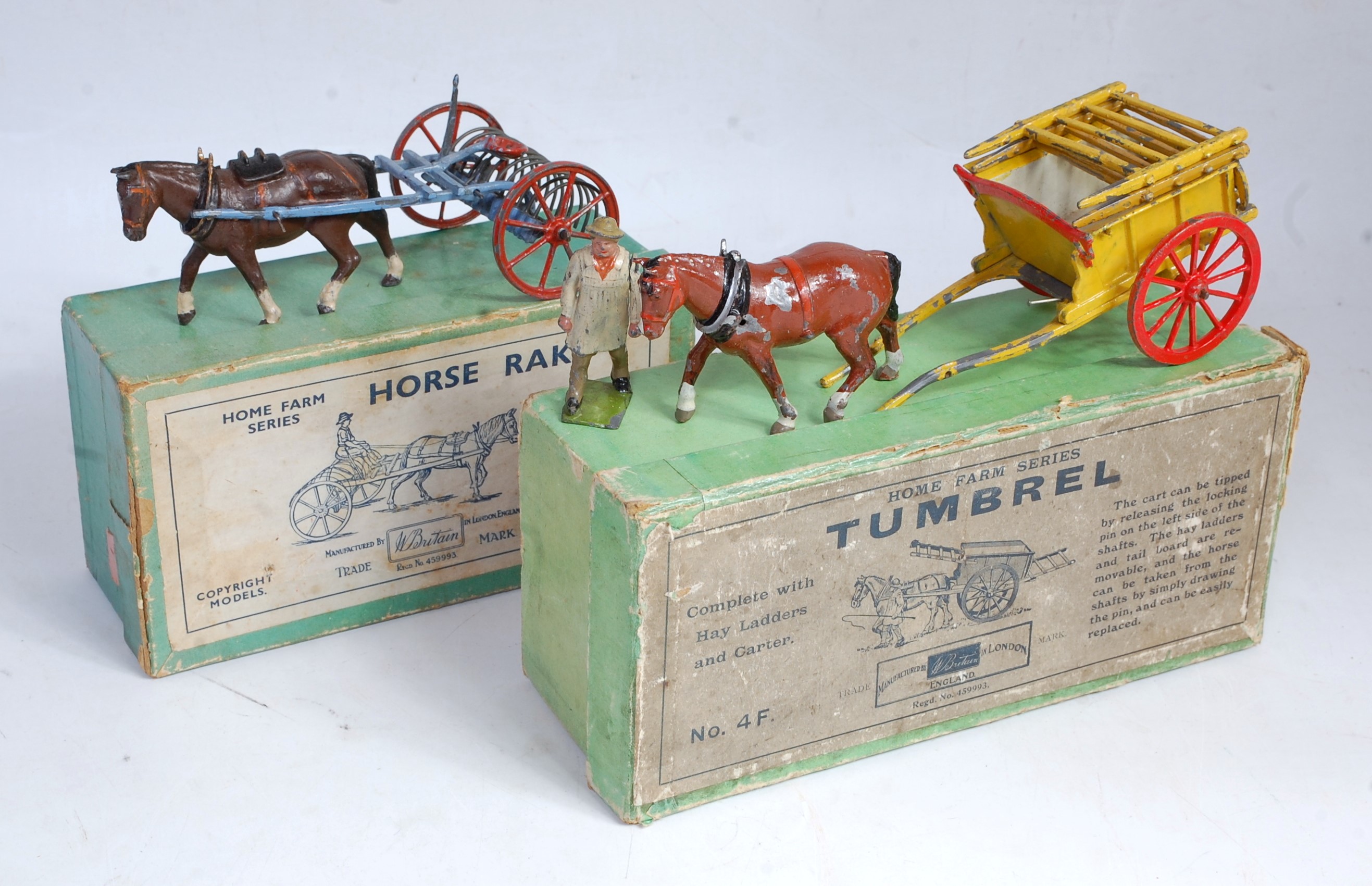 Four various boxed Britains Home Farm series horse drawn wagons and accessories to include No. 6F