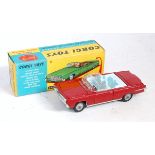 A Corgi Toys No. 246 Chrysler Imperial comprising red body with light blue interior and missing