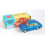 A Corgi Toys No. 251 Hillman Imp comprising metallic blue body with yellow interior and spun hubs in