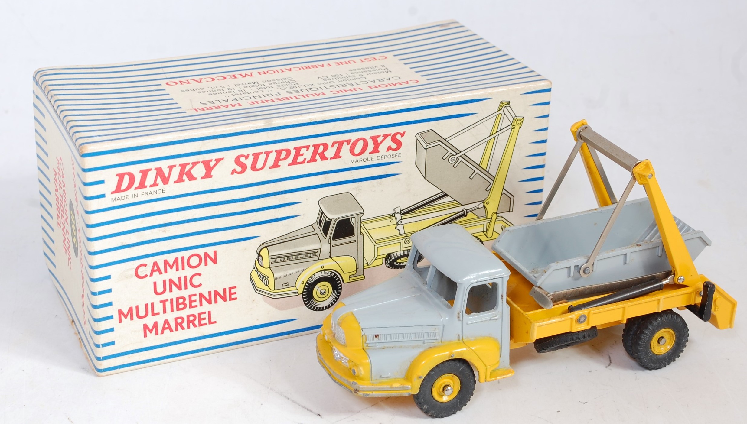 A French Dinky Toys No. 895 Camion Unic multi marrel skip lorry comprising of yellow and grey body
