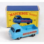 A Matchbox 1/75 series No. 60 Morris J2 pickup comprising of blue body with black plastic wheels and