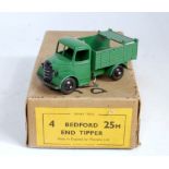 A Dinky Toys No. 25M Bedford End Tipper trade box and contents, containing one dark green Bedford