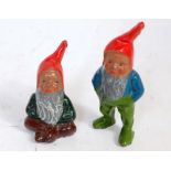 A Britains garden ornaments range, two garden gnomes, one standing and the other seated, both (VG)
