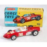 A Corgi Toys No. 154 Ferrari F1 Grand Prix racing car comprising of red body with spun hubs and