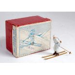 A Britains No. 2307 Ski Trooper comprising of ski trouper in white snow suit with slung rifle with