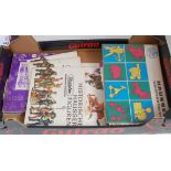 Two boxes containing a quantity of various soft and hardback books related to toy soldier collecting