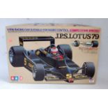 A Tamiya 1/10 scale plastic kit for a JPS Lotus 79 racing car, suitable for radio control