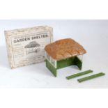 A Britains miniature garden series No. 28 MG Garden Shelter 1930s examples comprising of thatched