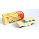 A Dinky Toys No. 141 Vauxhall Victor estate car, comprising lemon yellow body with blue interior and