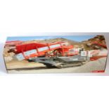 A Conrad 1/50 scale No. 2511/0 Sandvik mobile crushing unit UH440I, finished in red, grey and black,