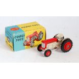 A Corgi Toys No. 50 Massey Ferguson 65 tractor, comprising of cream and red body with red hubs in