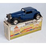 A Triang Minic tinplate and clockwork Vauxhall Cabriolet comprising dark blue and black body with