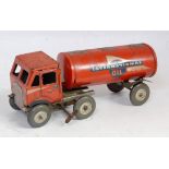 A Mettoy tinplate and clockwork International Oil tank transporter comprising of red cab and back