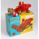 A Corgi Toys No. 1111 Massey Ferguson 780 combine harvester, comprising red body with yellow tines