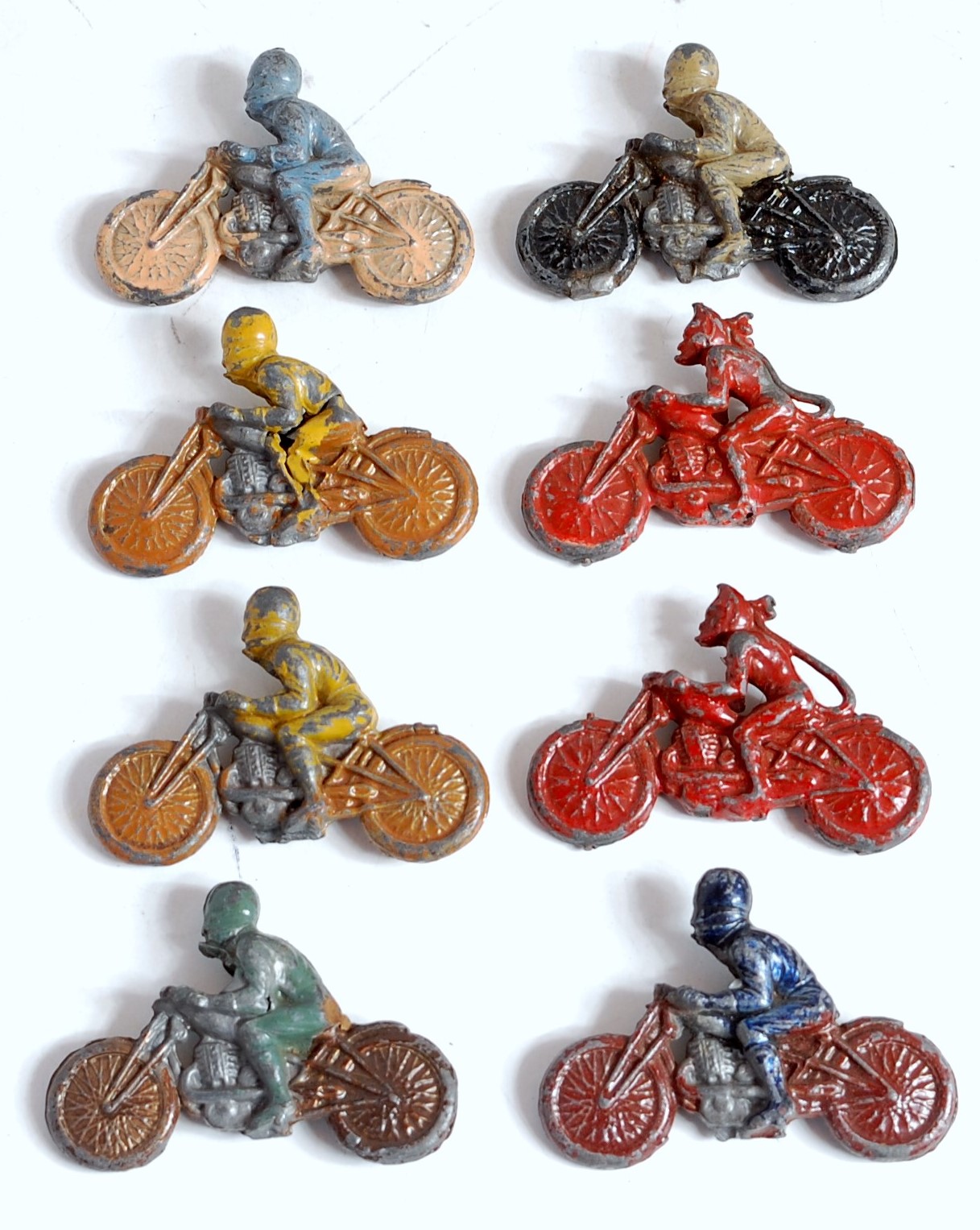 Eight various unusual lead hollow cast motorcycle riders, six examples with motorcycle and driver