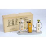 A Britains set No. 101V petrol pumps gift set, comprising of 3 various petrol pumps, raised on