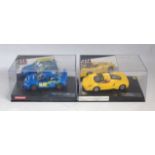 Two plastic cased Carrera Evolution boxed slot cars, to include a Subaru Impreza WRC and an Enzo