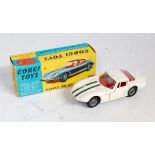 A Corgi Toys No. 324 Marcos 1800 GT comprising of white body with green racing stripe and silver