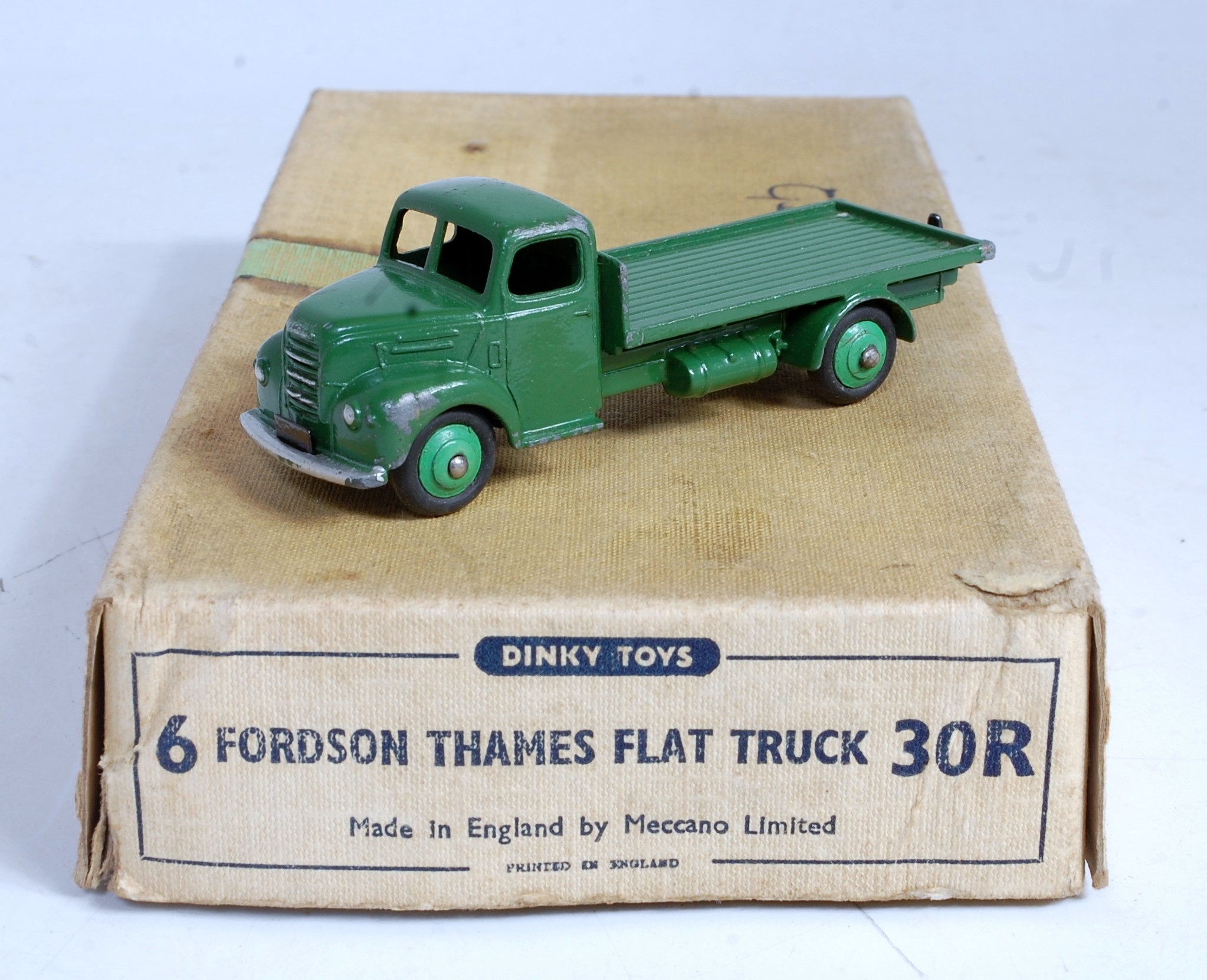 A Dinky Toys trade box No. 30R Fordson Thames flat truck containing one green example, box is