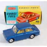 A Corgi Toys No. 251 Hillman Imp saloon comprising of metallic blue body with yellow interior,