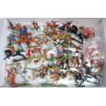 A collection of mixed scale Elastolin and other plastic and composition figures to include Wild West